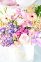 Pink and purple flowers box with balloon