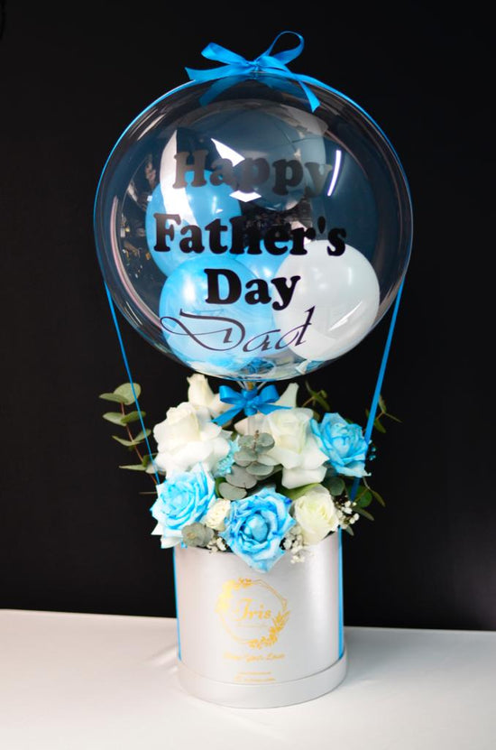 Blue flowers box with balloon