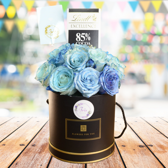 blue flowers & chocolate in box