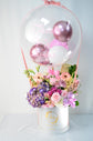 Pink and purple flowers box with balloon
