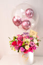 Pink flowers box with balloons