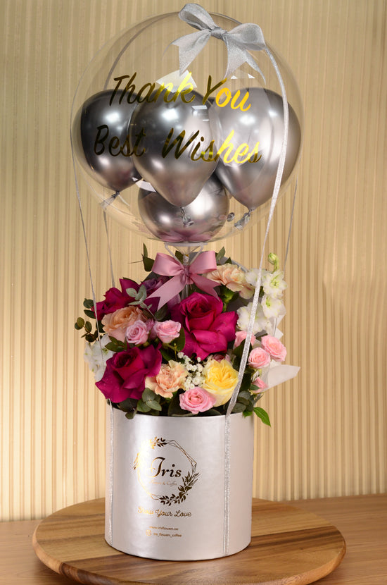 Pink flowers and balloon in Box