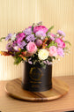 Pink artificial and fresh flowers box
