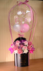 Pink flowers with balloon in box