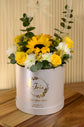 Yellow flowers with balloon in box