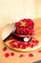 red rose in heart box