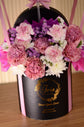 Pink flowers with balloon in box