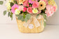 Pink and white flowers in hand bag